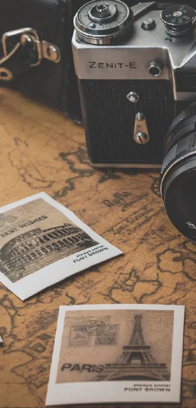 Vintage camera on a map with travel photos in sepia tones.
