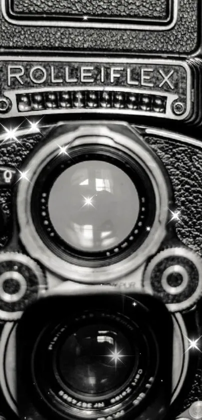 Black and white vintage Rolleiflex camera with sparkles.