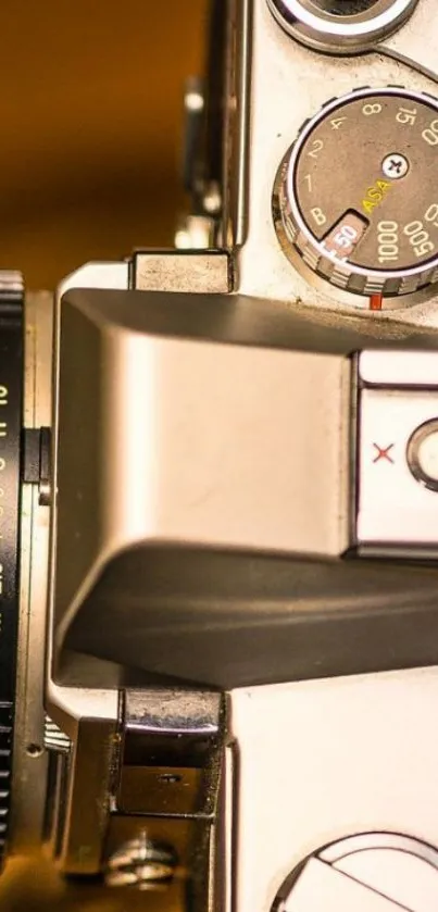 Close-up of a vintage camera with detailed features.