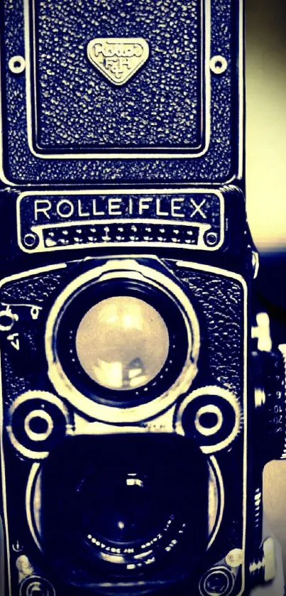 Vintage Rolleiflex camera in navy blue tones for mobile wallpaper.