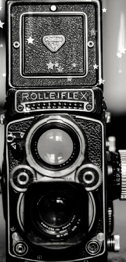 Black and white vintage Rolleiflex camera wallpaper with yellow text.