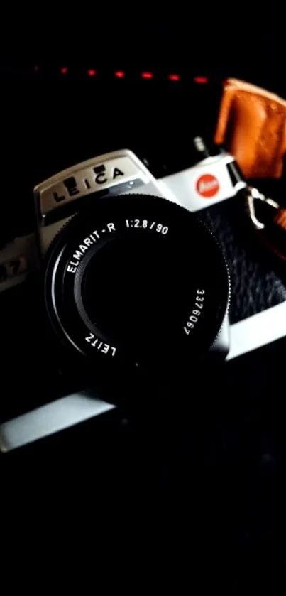 Close-up of a vintage film camera with lens.