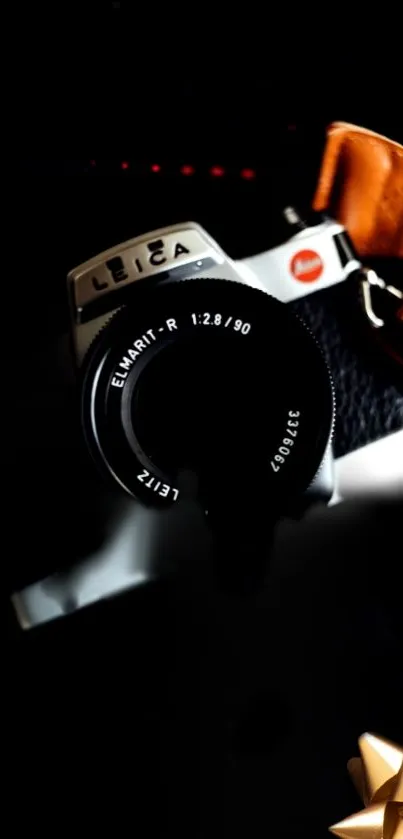 Vintage Leica camera with artistic shadow effects in dark tones.