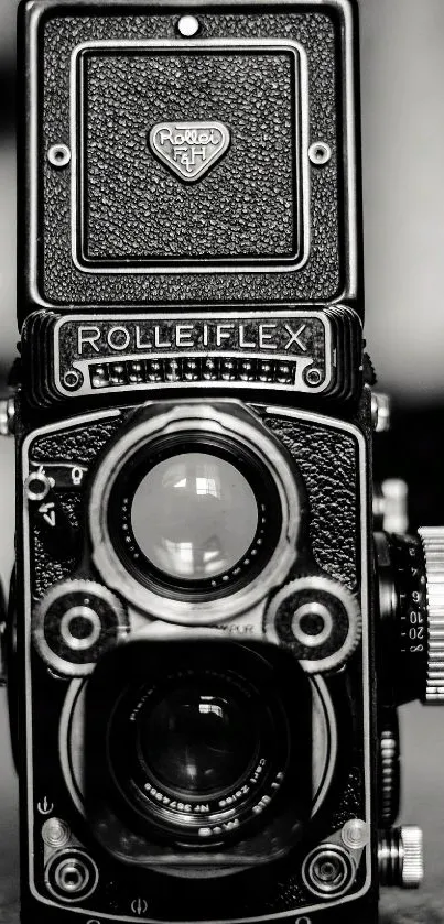 Vintage black and white camera emphasizing retro photography style.