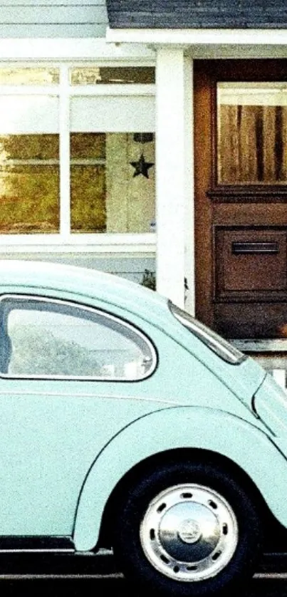 Vintage mint green car in front of a cozy cottage.