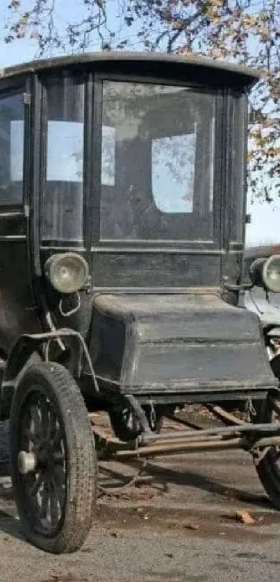 Vintage car in an autumn setting on a mobile wallpaper background.