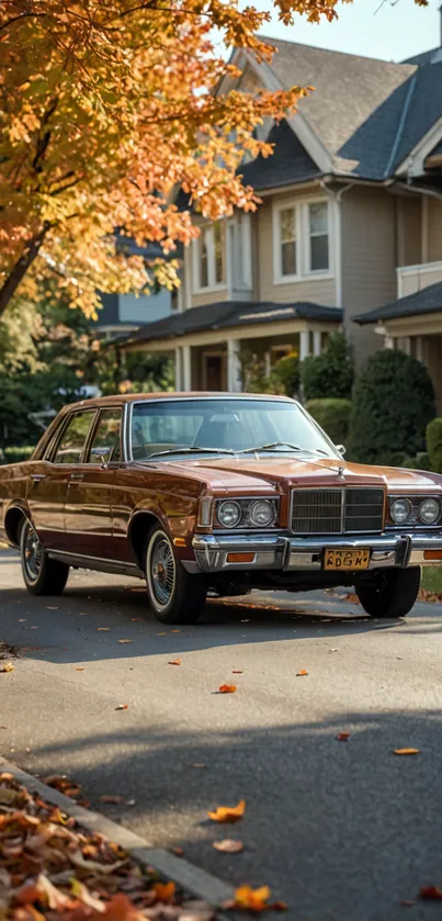 Vintage car on suburban street with autumn foliage.