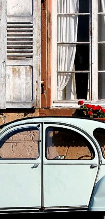 Vintage car parked by a rustic house with shutters.