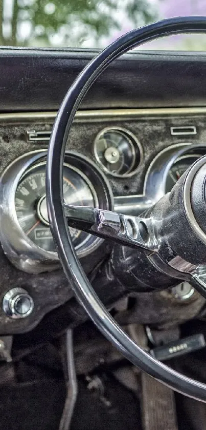 Vintage car dashboard with steering wheel and classic design.