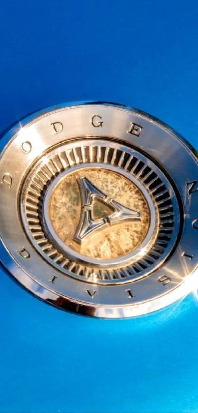 Vintage car emblem on a blue background wallpaper.