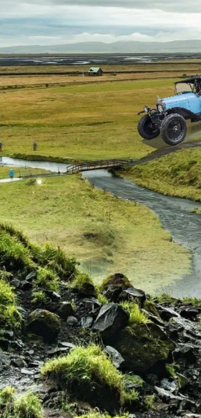 Vintage car set against lush green meadows under a cloudy sky.