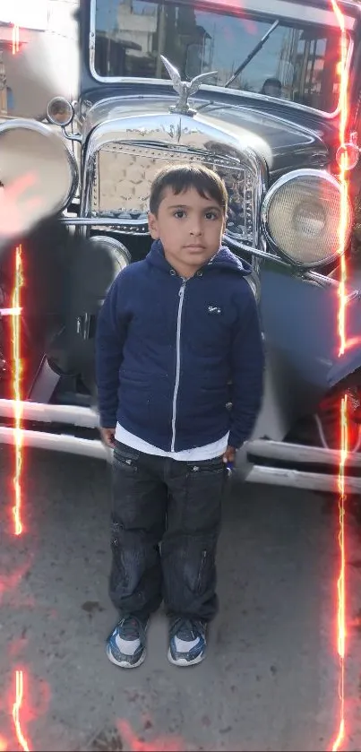 Child stands in front of vintage car with flame effects in background.