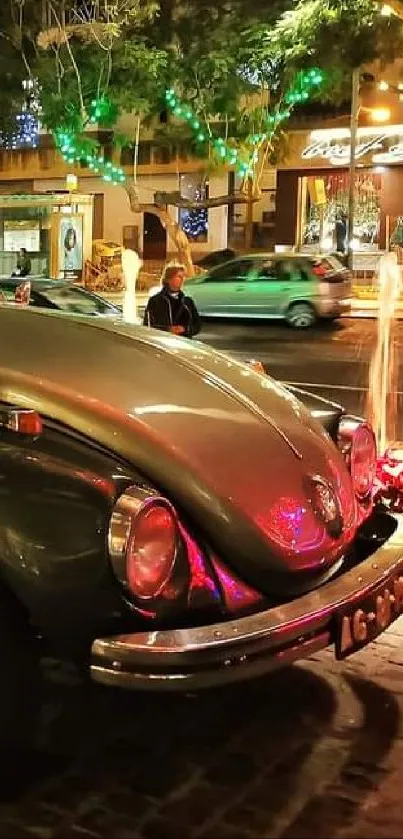 Vintage Volkswagen Beetle at night, adorned with colorful city lights and reflections.