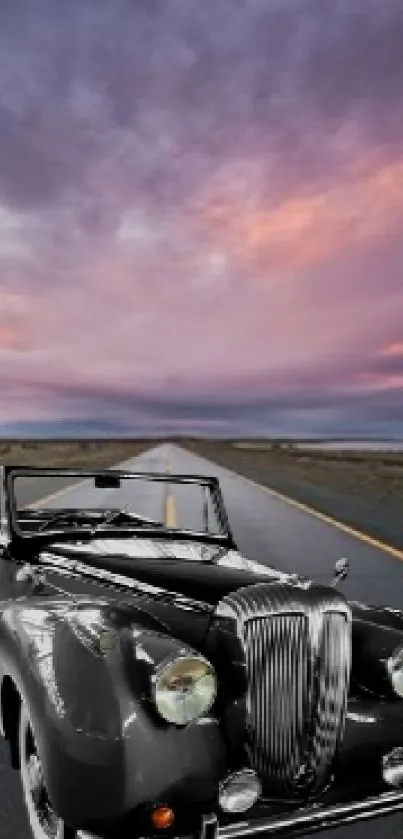 Vintage car on an open road with a dramatic purple sky.