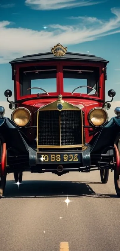 Vintage car on scenic road under blue sky.