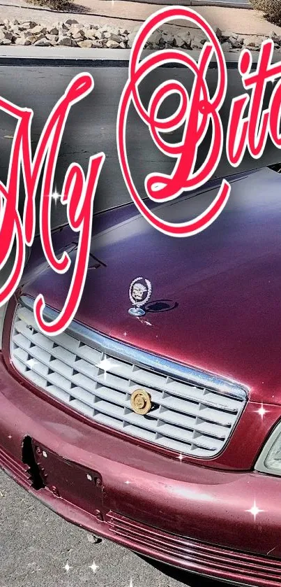 Vintage car parked on street with red design and bold text.