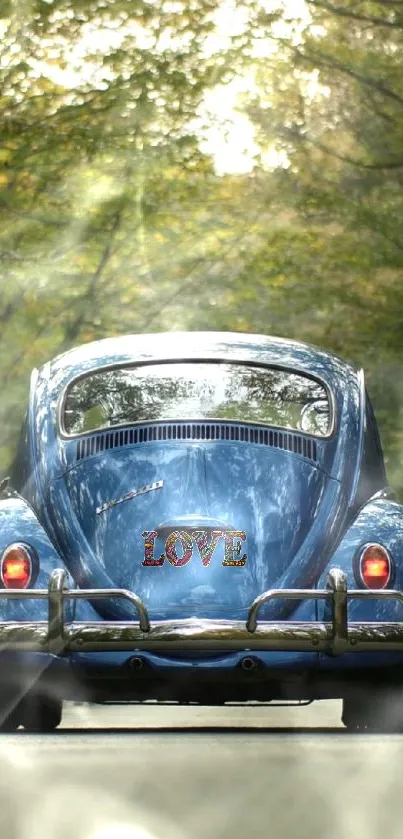 Blue vintage car on scenic road with 'Love' text