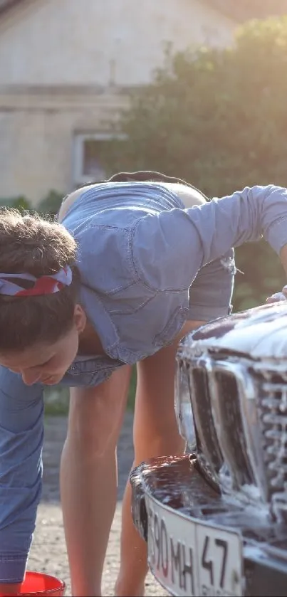 Woman washing vintage car with soap outdoors.