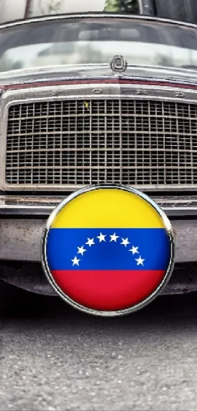 Vintage car with Venezuelan flag emblem in urban alley.