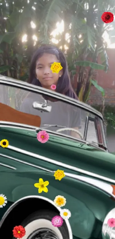 Vintage green car with colorful flowers and lush background.