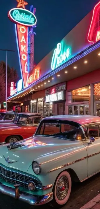 Vintage cars parked outside a neon diner at night.