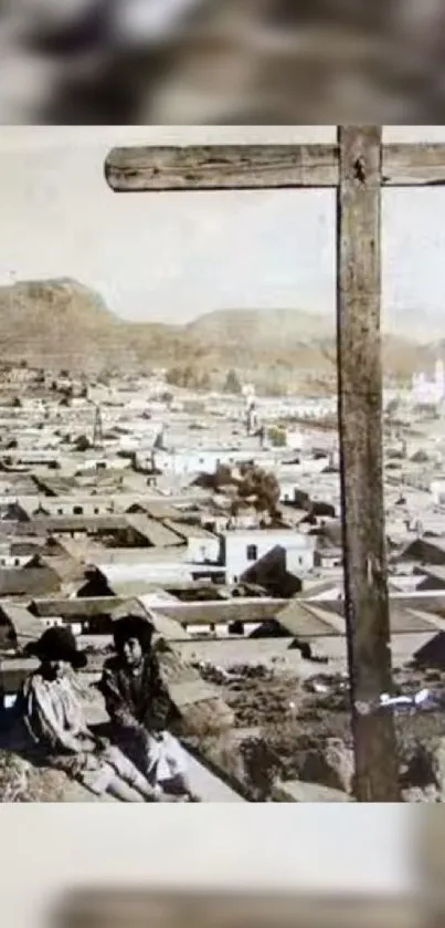 Sepia-toned cityscape with a large cross in the foreground.