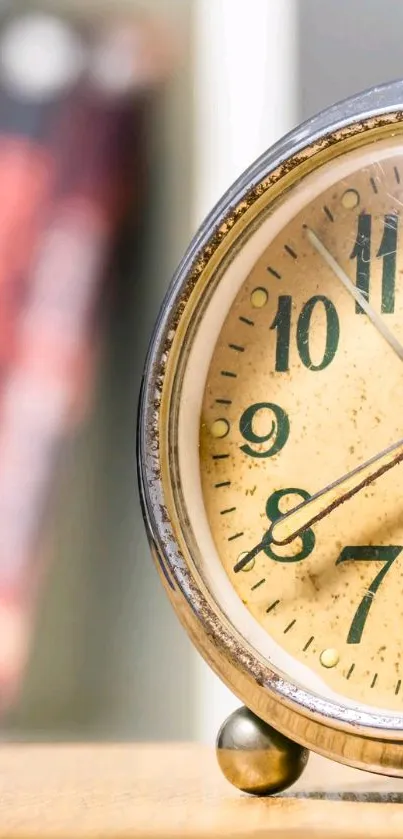 Close-up of a vintage clock against a blurred background, perfect for a classic wallpaper.