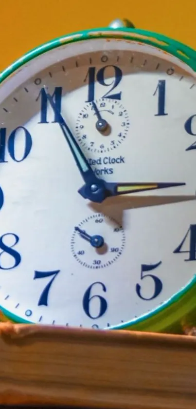 Vintage clock on books with yellow background wallpaper.