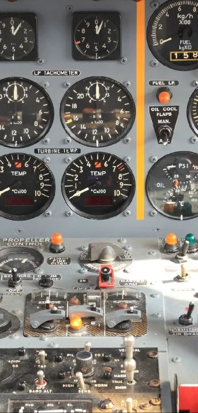 Vintage aircraft cockpit panel with various dials and controls.