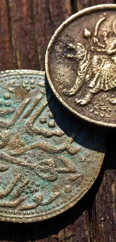 Intricate vintage coins on wooden background, capturing detailed antique designs.