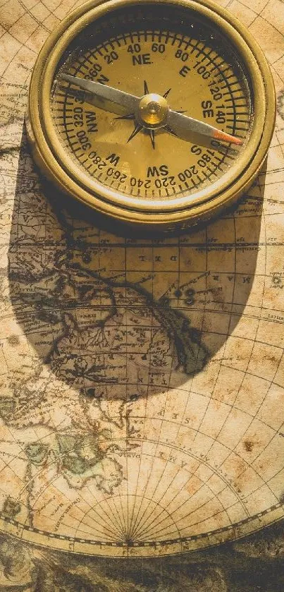 Vintage compass resting on an antique map background.