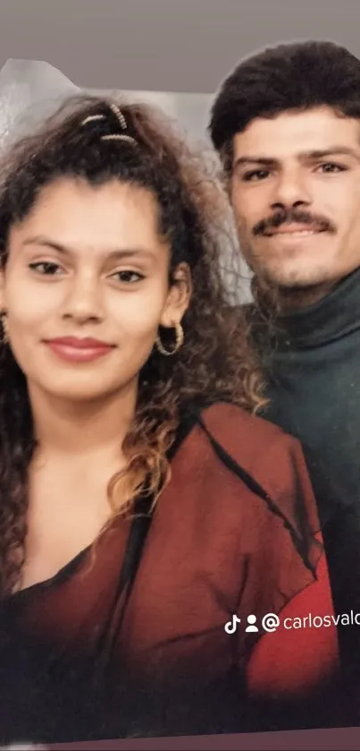 Smiling couple in vintage portrait style.