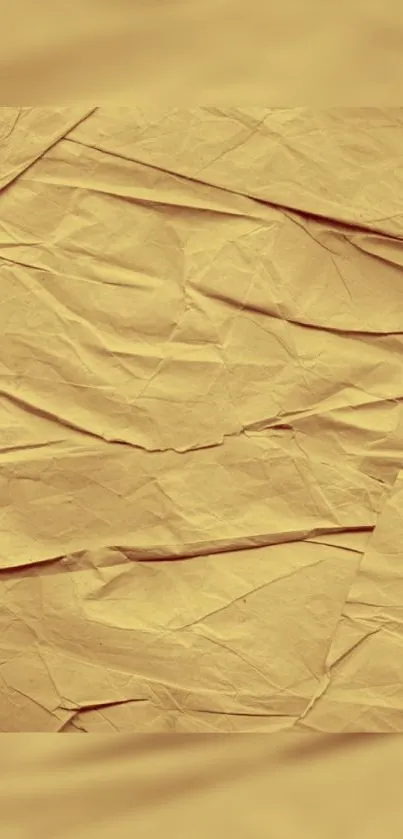 Crumpled tan paper wallpaper with a vintage design.