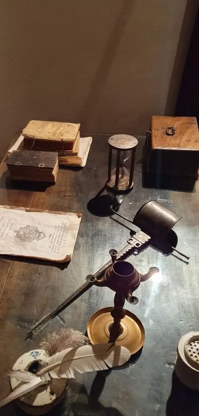 Vintage desk with quill, books, and candle holder.