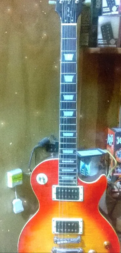 Vintage electric guitar against a wooden background.