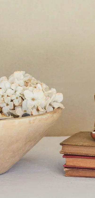 Vintage clock with books and flowers in beige tones.