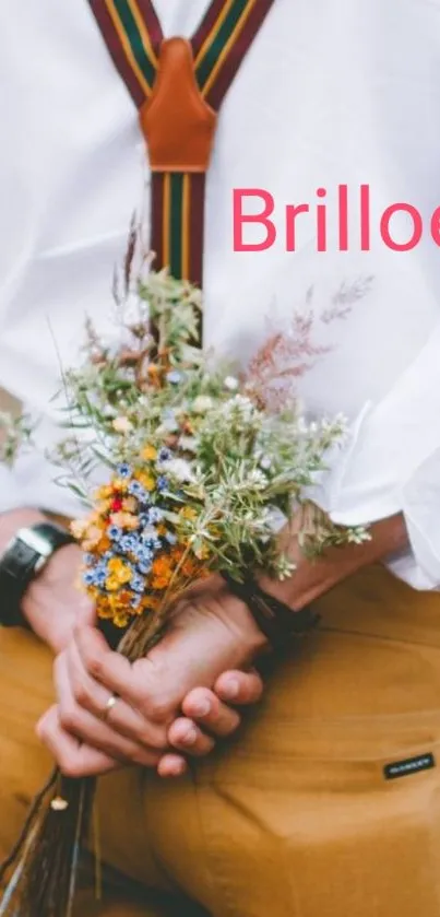 Person holding bouquet behind back, wearing suspenders.