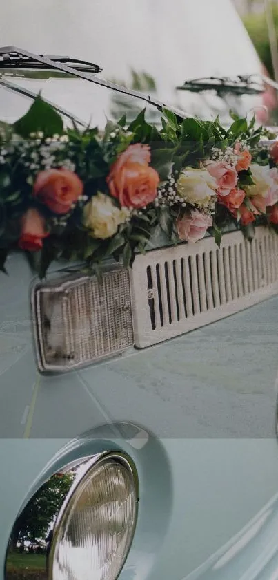 Vintage van with floral decorations and light blue color.