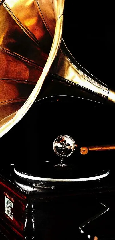 A vintage gramophone with a golden horn on a dark background.