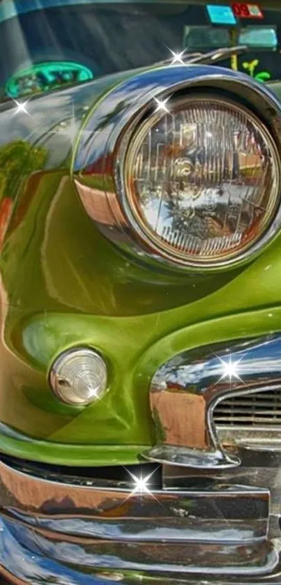 Close-up of a vintage green car's headlight with shiny chrome details.