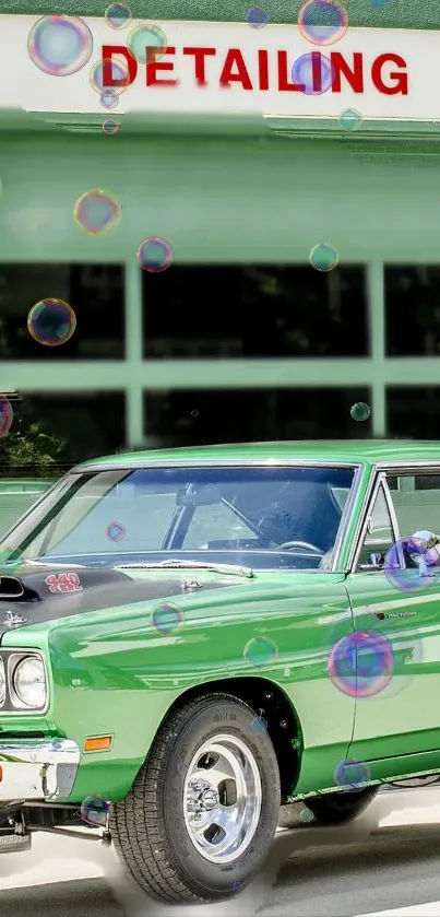 Green vintage car with soap bubbles at a detailing garage.