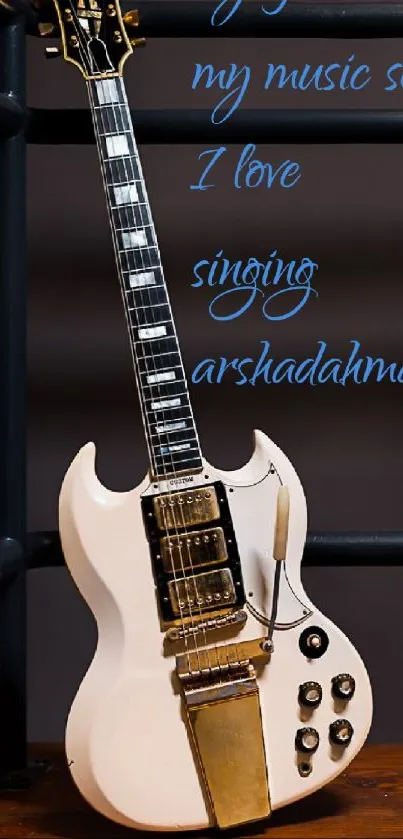 Vintage white guitar with elegant blue typography on a dark background.