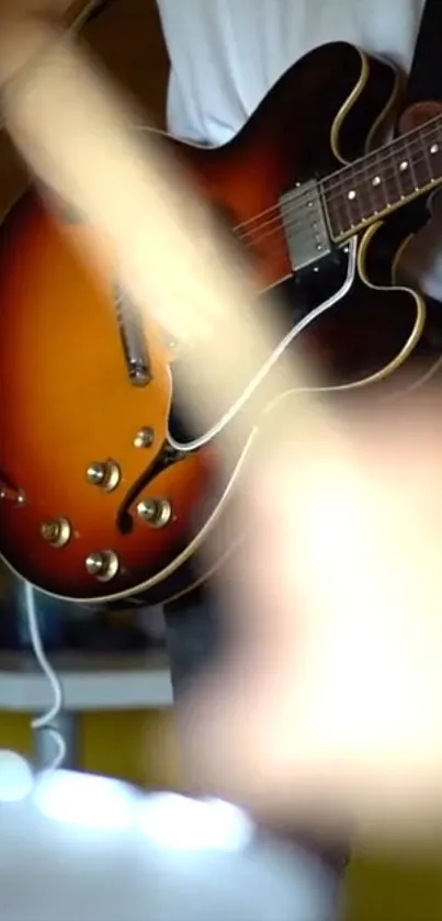 Person playing a vintage electric guitar with blurred background.