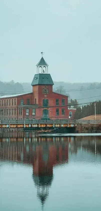 Vintage brick building reflecting on a calm lake.