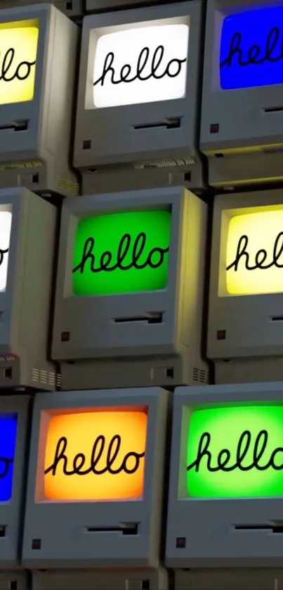 Colorful vintage Macintosh computers displaying 'hello'.