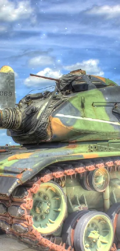 Vintage military tank with green tones under a blue sky, shot outdoors.