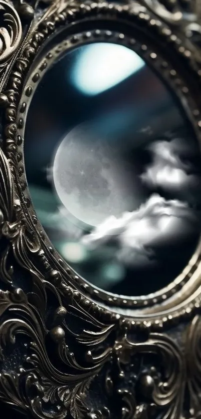 Vintage mirror with moon reflection and ornate frame design.