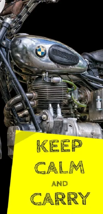 Vintage motorcycle with 'Keep Calm and Carry On' sign on a black background.