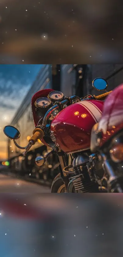 Vintage motorcycle at sunset with vibrant red tones.