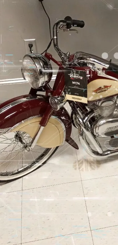 Vintage red and cream motorcycle on tiled floor.